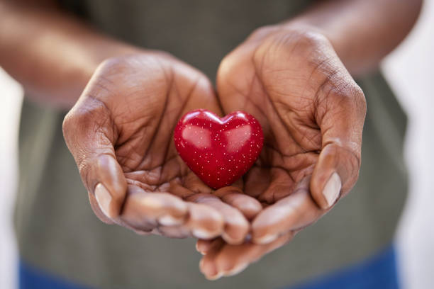 Hands holding a red heart